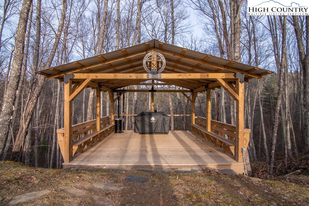 232 Bertie Circle Piney Creek, NC 28663 - Photo 10 of 50 a view of a small house with a small yard