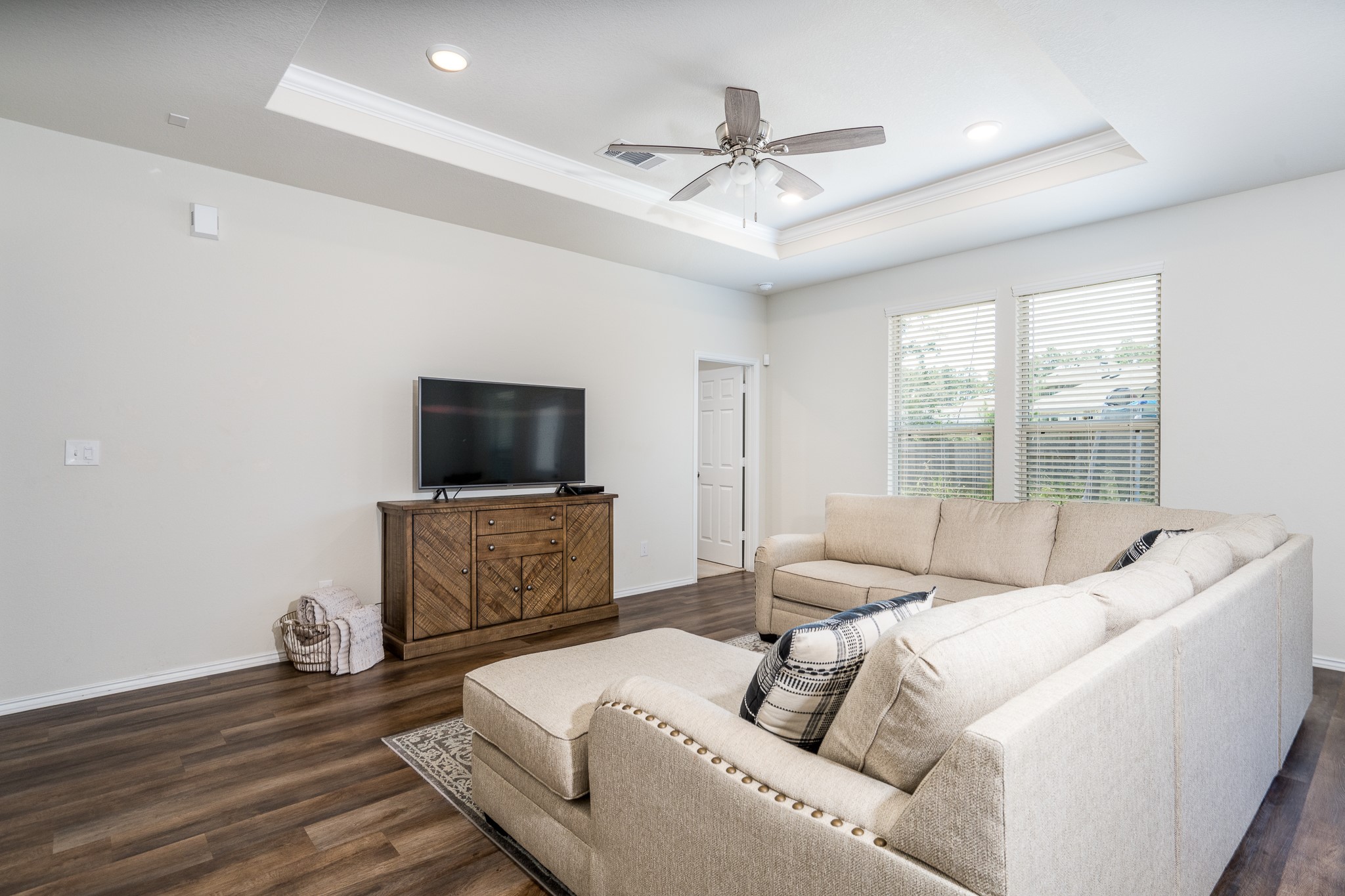 4256 Pine Still Road Conroe, TX 77304 - Photo 12 of 21 a living room with furniture and a flat screen tv
