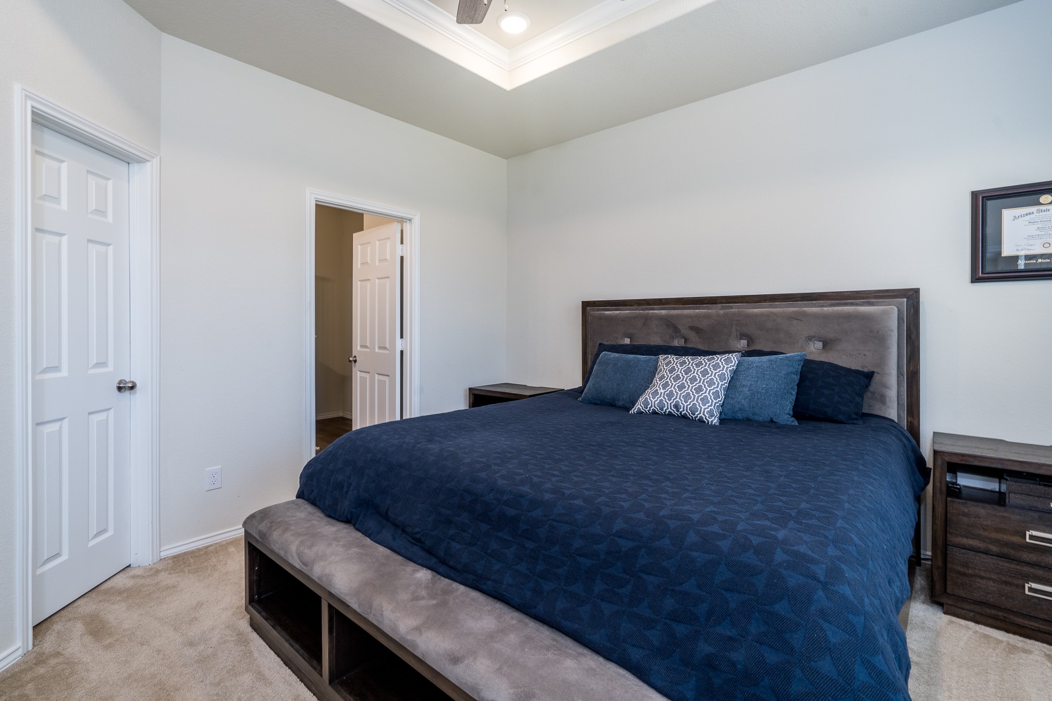 4256 Pine Still Road Conroe, TX 77304 - Photo 13 of 21 a bedroom with a bed and a night stand