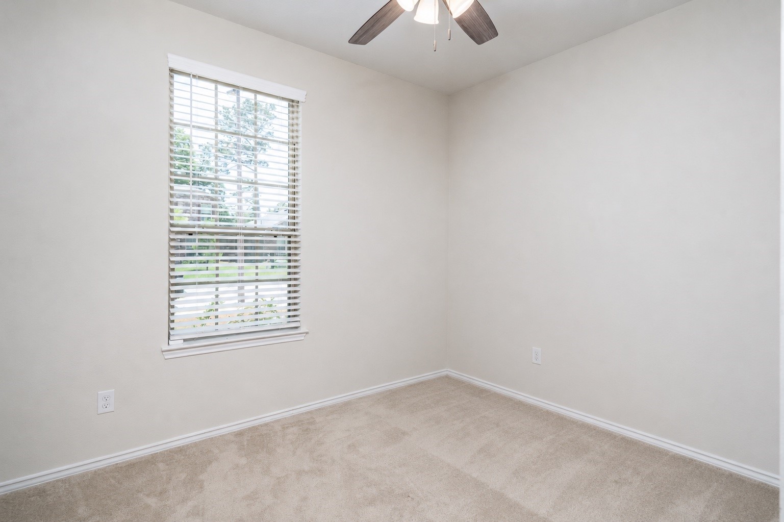4256 Pine Still Road Conroe, TX 77304 - Photo 16 of 21 an empty room with a window