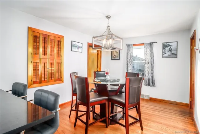 a dining room with furniture and window
