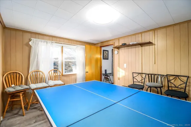 a bedroom with furniture and a window