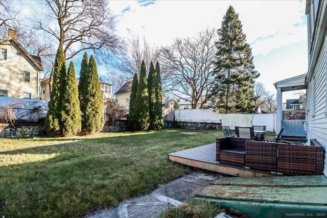 a view of a garden with furniture