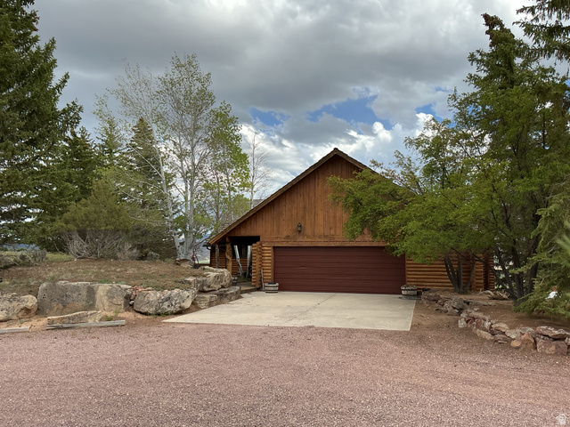 550 State Line Road Manila, UT 84046 - Photo 5 of 41 Log-style exterior with wood-finish siding and a gable roof