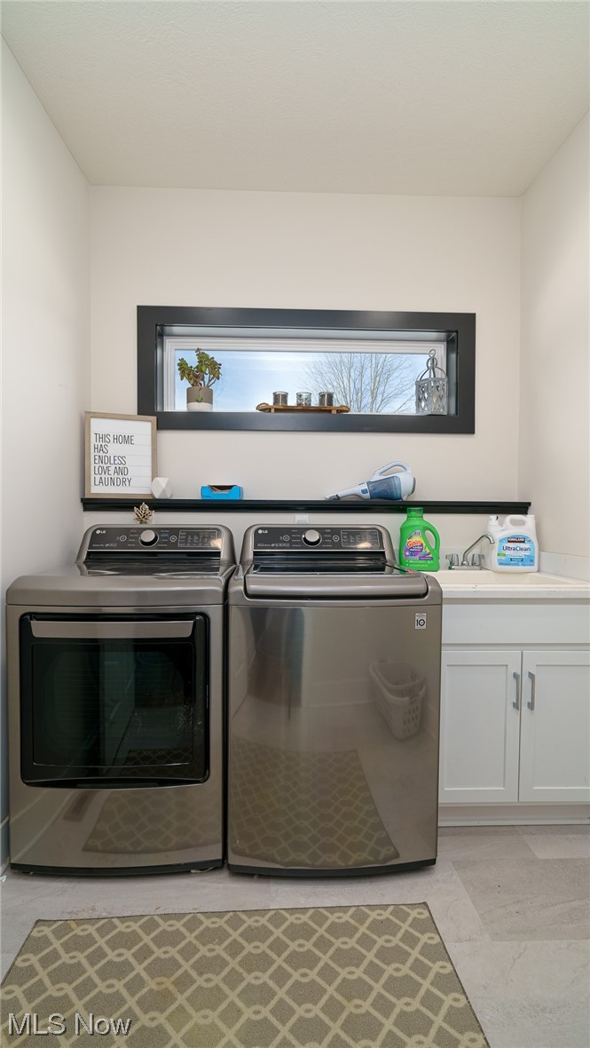 1849 Fixler Road Wadsworth, OH 44281 - Photo 26 of 39 Laundry area featuring independent washer and dryer, cabinets, and sink