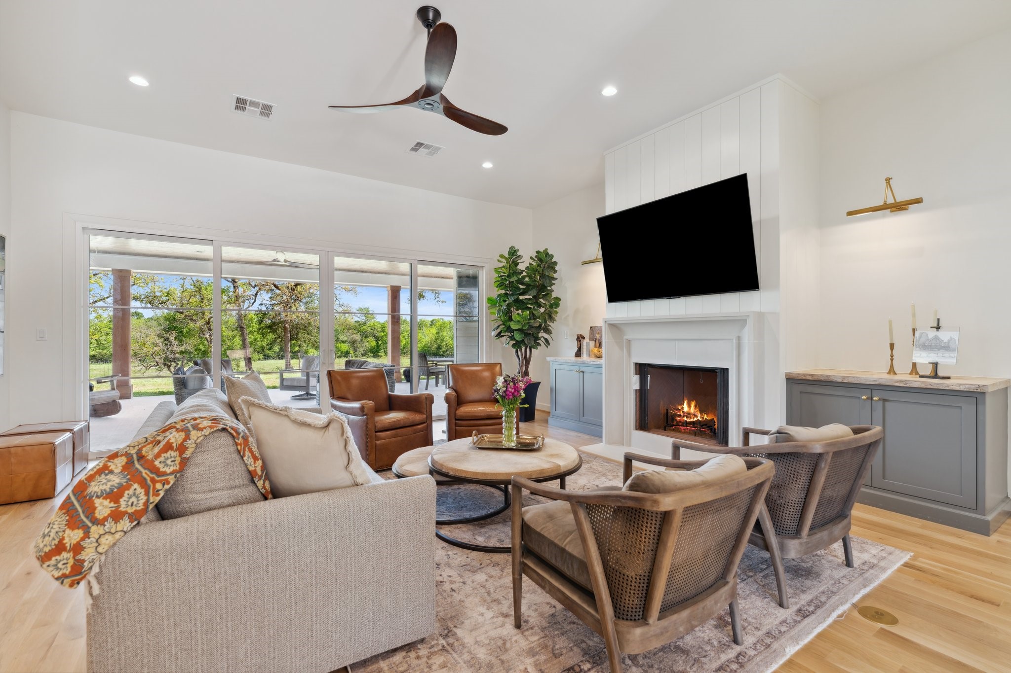 4052 Kuykendall Road Bellville, TX 77418 - Photo 5 of 40 Experience seamless indoor-outdoor living in the family room with sliding doors that open to a stunning porch and breathtaking property views.