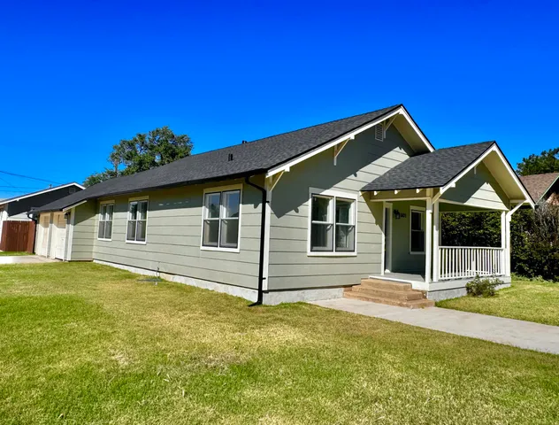 a front view of a house with yard