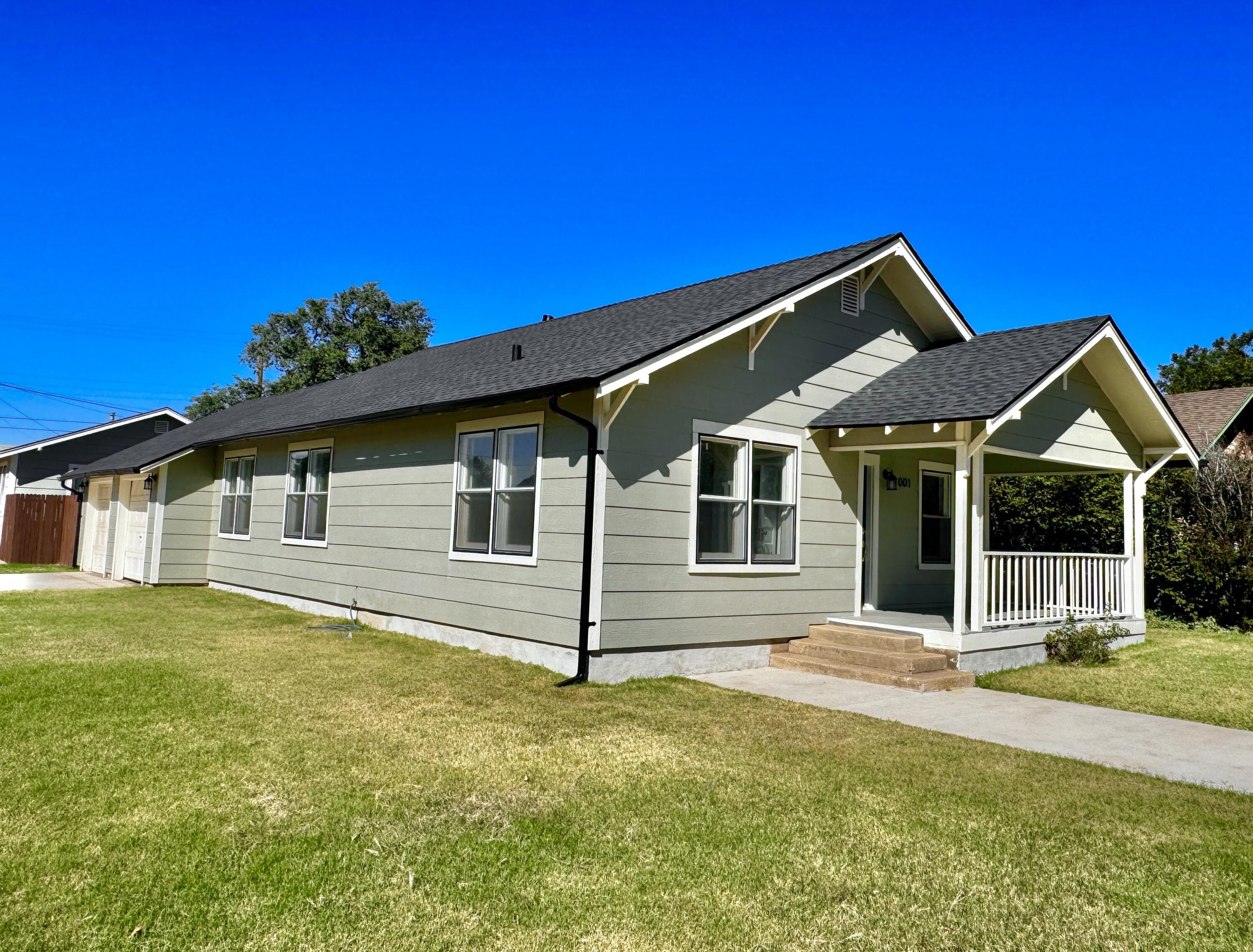 a front view of a house with yard