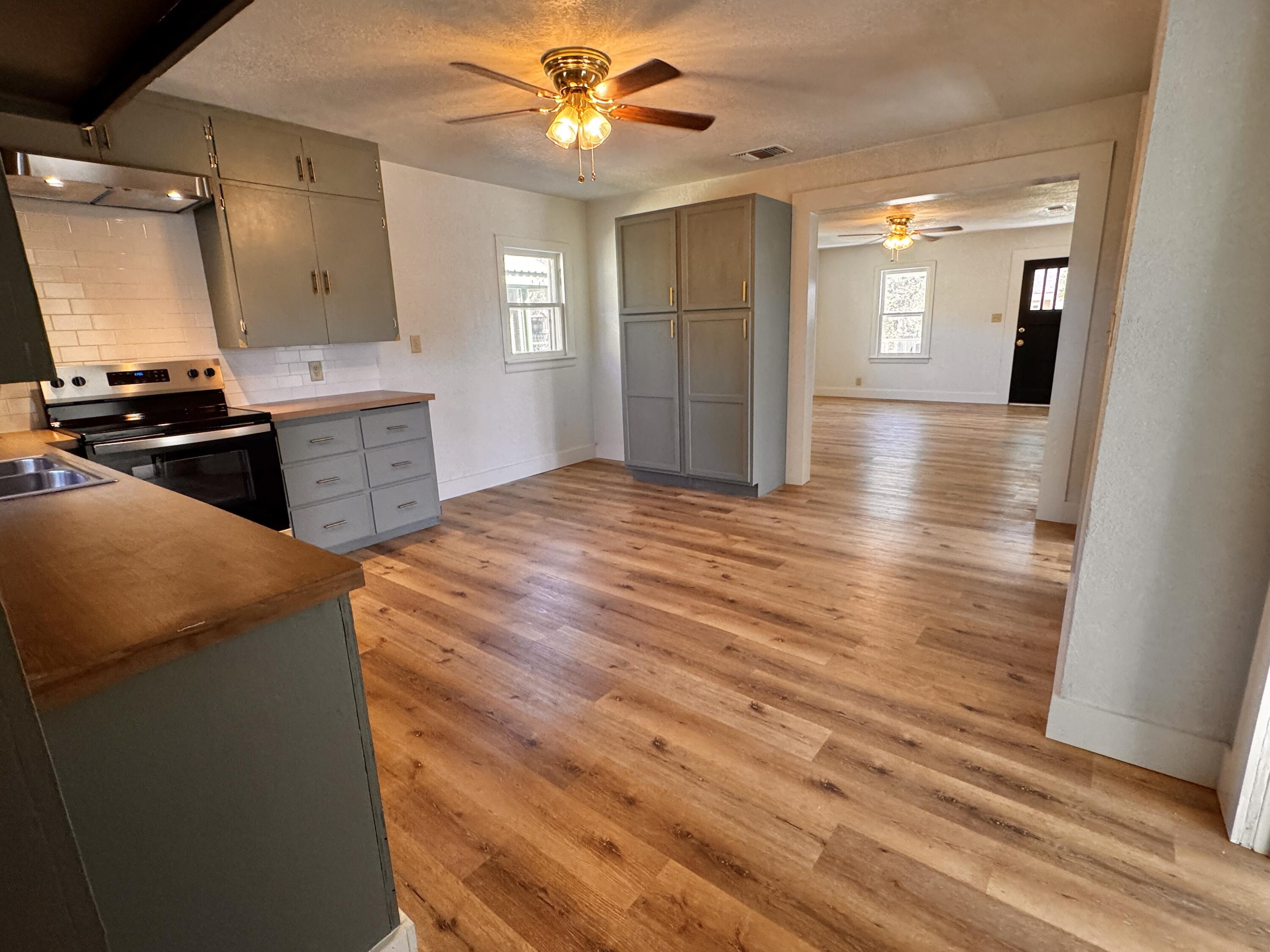 1001 Lexington Plainview, TX 79072 - Photo 13 of 31 a kitchen with stainless steel appliances granite countertop a sink and a refrigerator