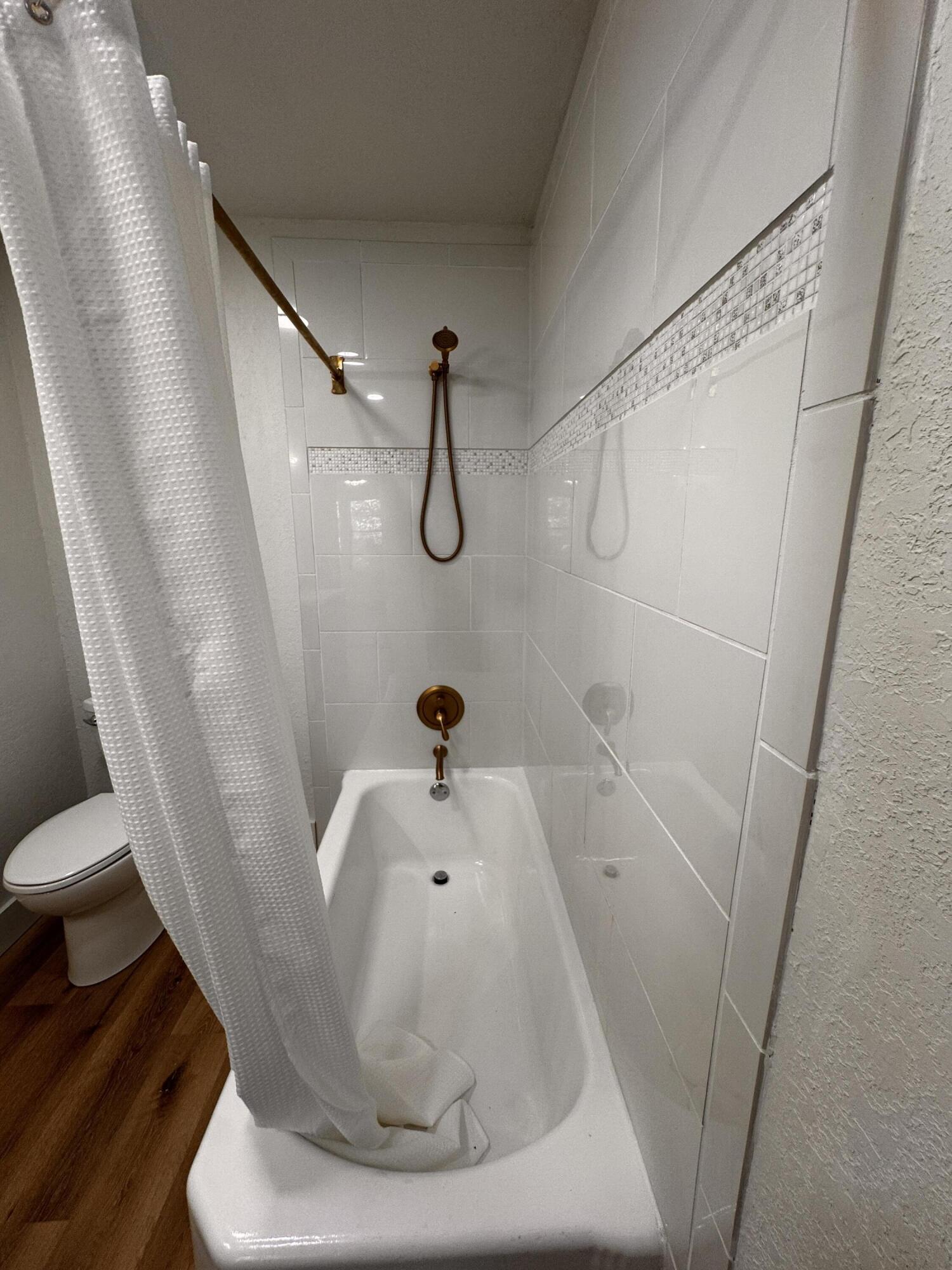 1001 Lexington Plainview, TX 79072 - Photo 20 of 31 a bathroom with a sink and a tub