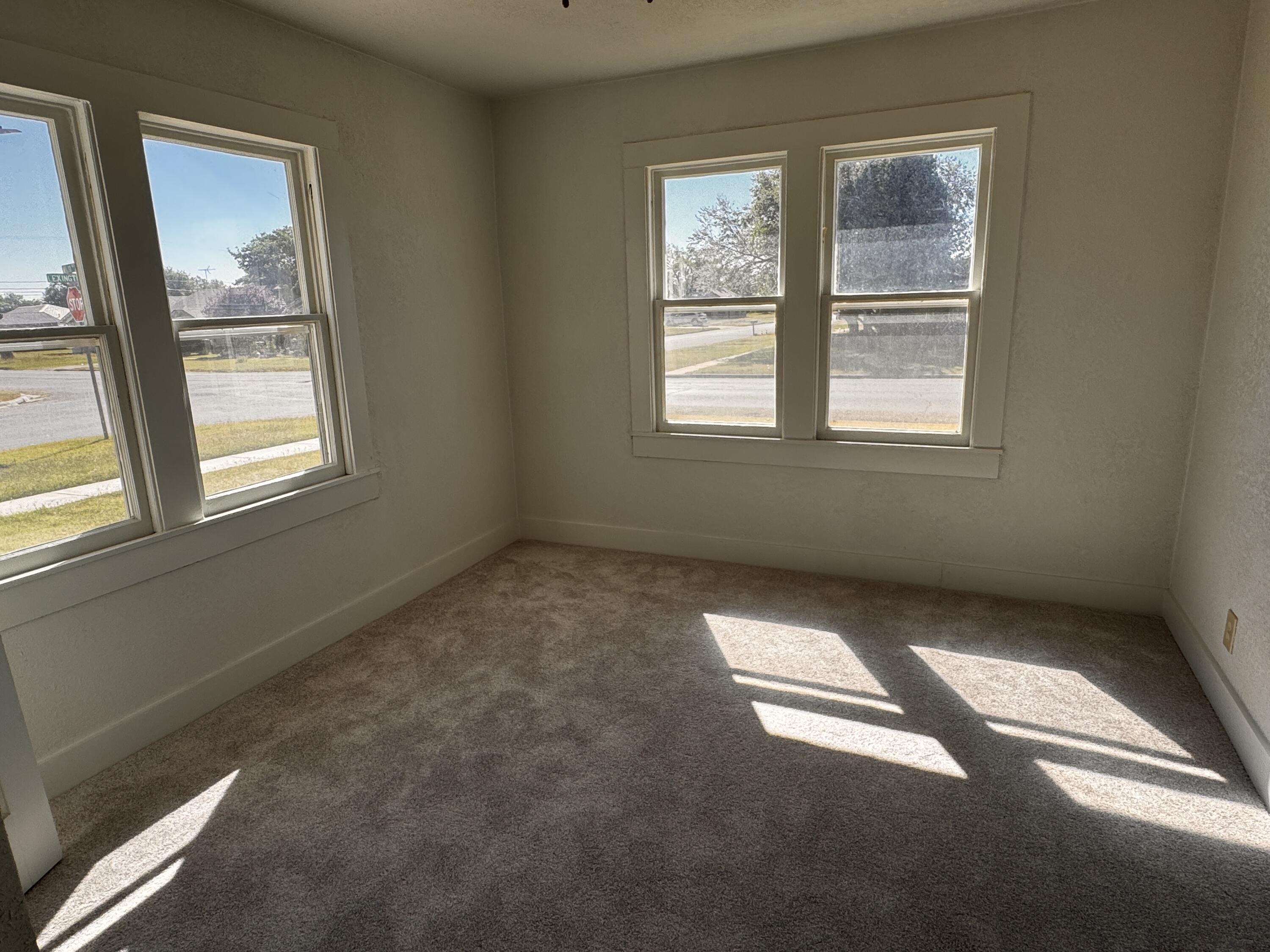 1001 Lexington Plainview, TX 79072 - Photo 23 of 31 an empty room with windows