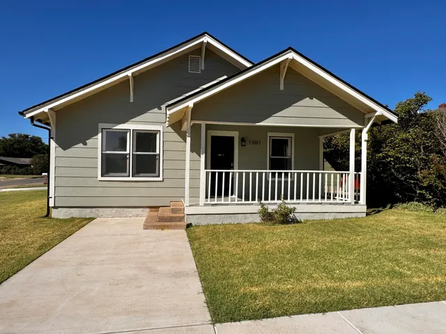 a front view of a house with garage