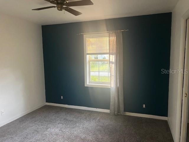 33 Seven Wonders Trail Palm Coast, FL 32164 - Photo 7 of 9 an empty room with a window