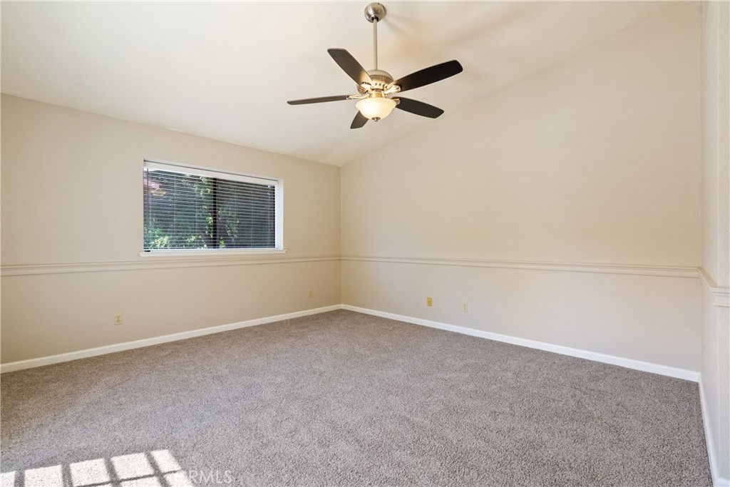 6815 Santa Lucia Road, Unit 5 Atascadero, CA 93422 - Photo 20 of 44 Primary bedroom with room to spread out. Gentle cathedral ceiling, new carpet, modern ceiling fan add to the beauty of the room.