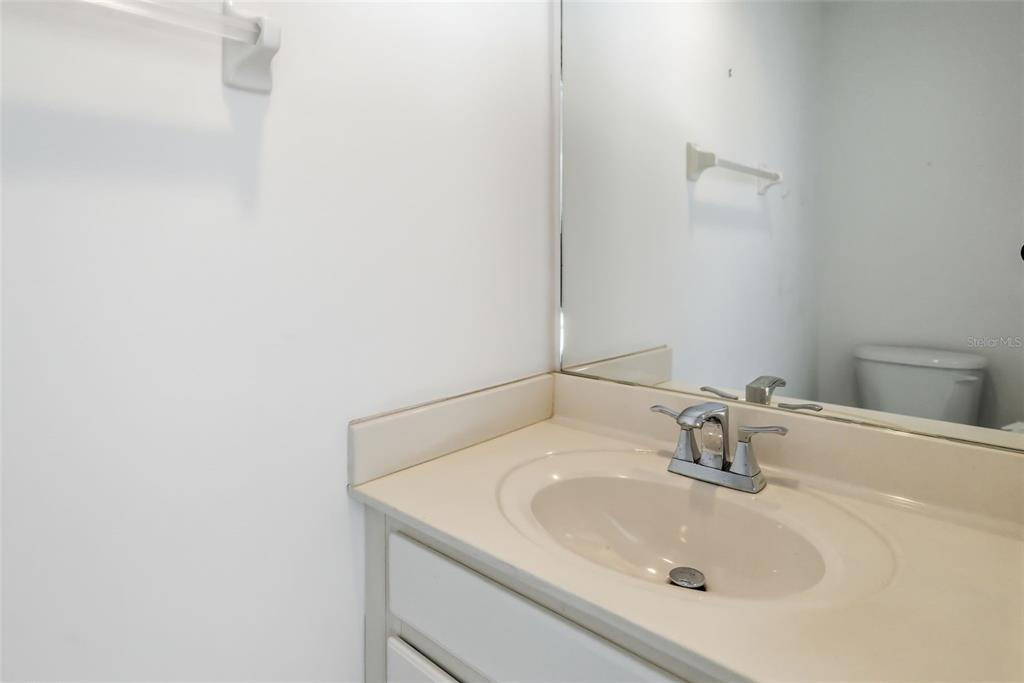 7631 Desert Inn Way Lakewood Ranch, FL 34202 - Photo 18 of 100 a bathroom with a sink and mirror