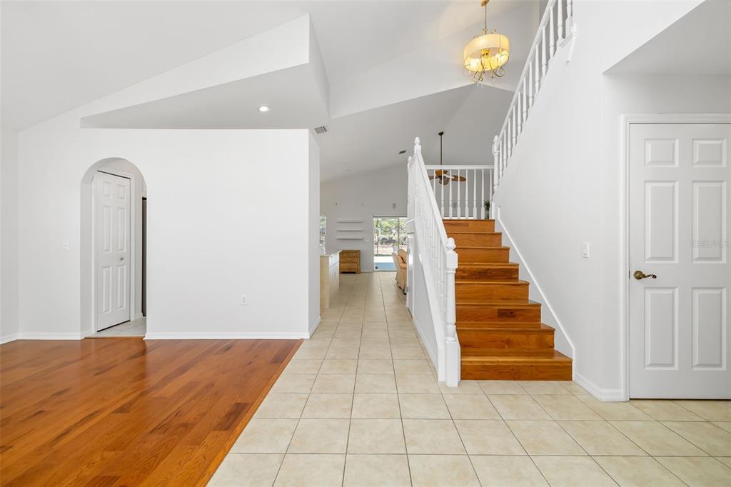 7631 Desert Inn Way Lakewood Ranch, FL 34202 - Photo 23 of 100 a view of a hallway with wooden floor and staircase