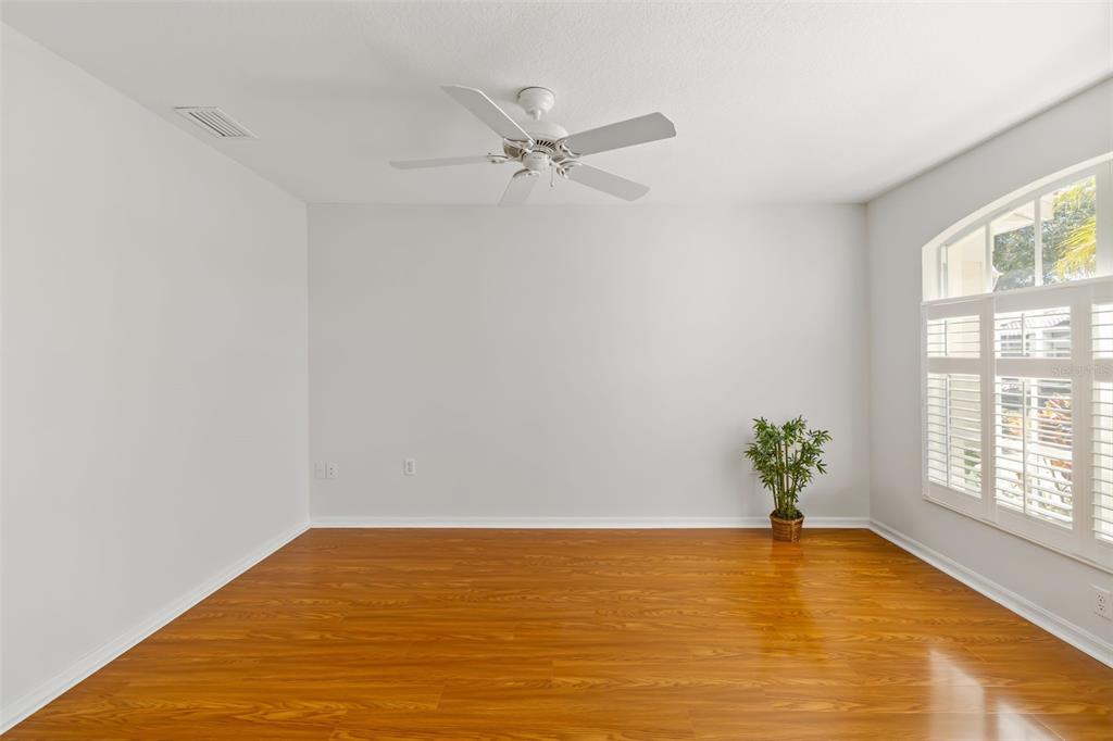 7631 Desert Inn Way Lakewood Ranch, FL 34202 - Photo 25 of 100 a view of empty room with window and ceiling fan