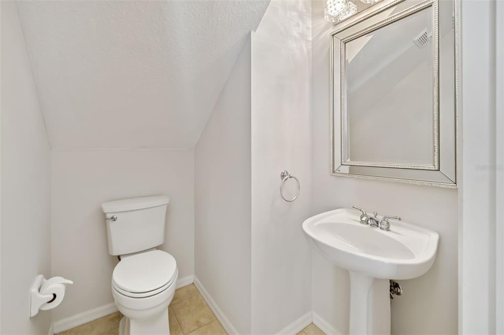 7631 Desert Inn Way Lakewood Ranch, FL 34202 - Photo 27 of 100 a bathroom with a toilet sink and mirror