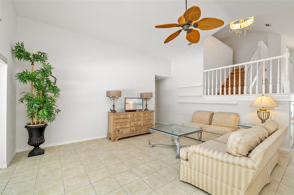 7631 Desert Inn Way Lakewood Ranch, FL 34202 - Photo 36 of 100 a bedroom with furniture and a potted plant