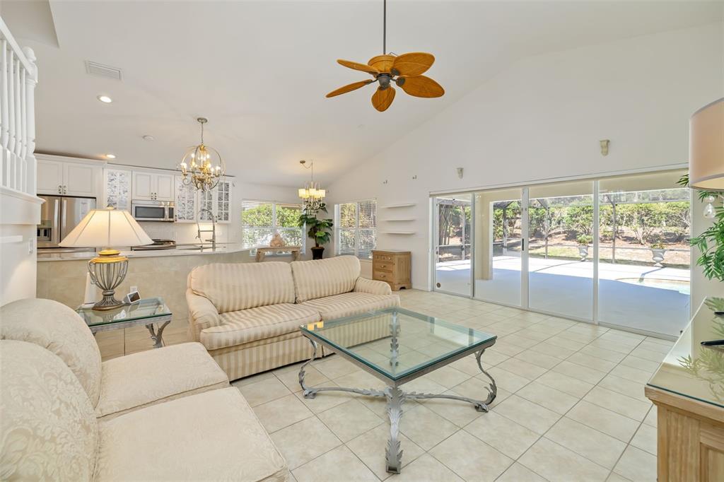 7631 Desert Inn Way Lakewood Ranch, FL 34202 - Photo 37 of 100 a living room with furniture and a large window