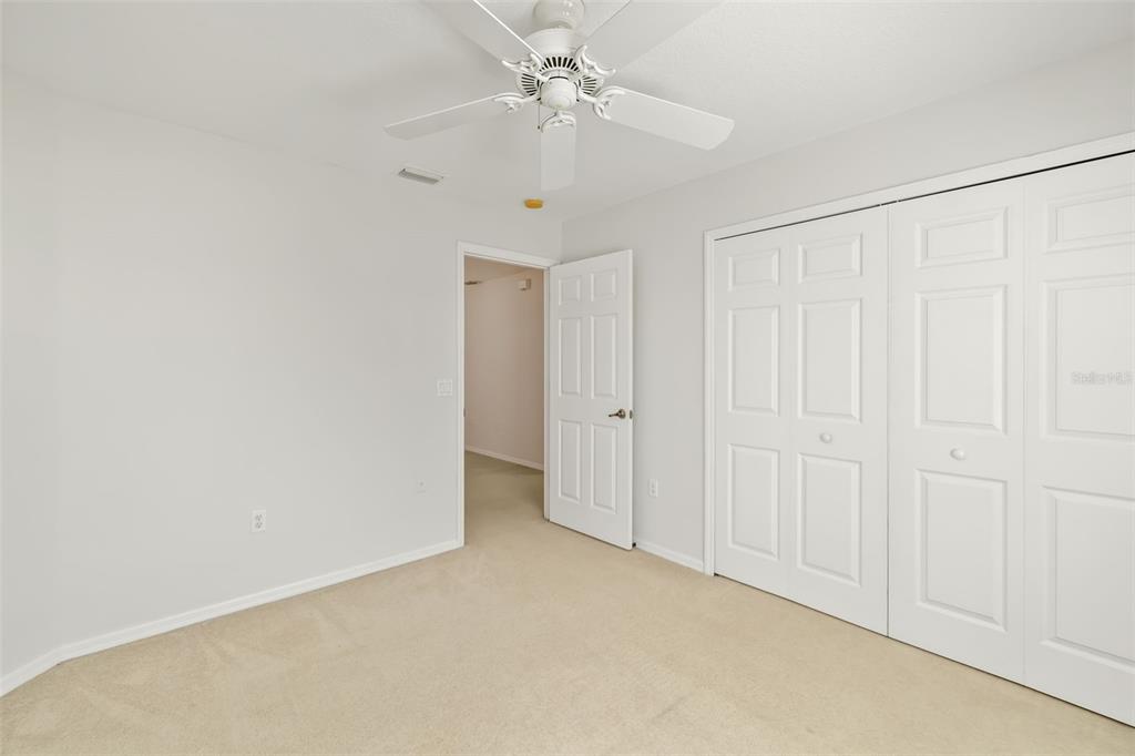 7631 Desert Inn Way Lakewood Ranch, FL 34202 - Photo 51 of 100 an empty room with fan