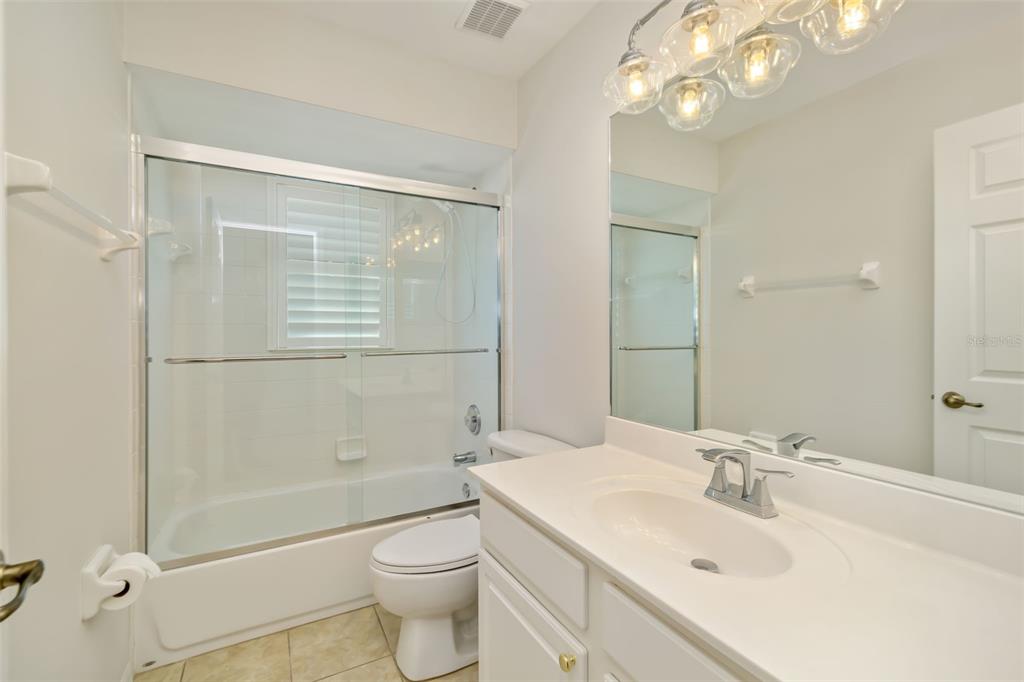 7631 Desert Inn Way Lakewood Ranch, FL 34202 - Photo 56 of 100 a bathroom with a sink a toilet and shower