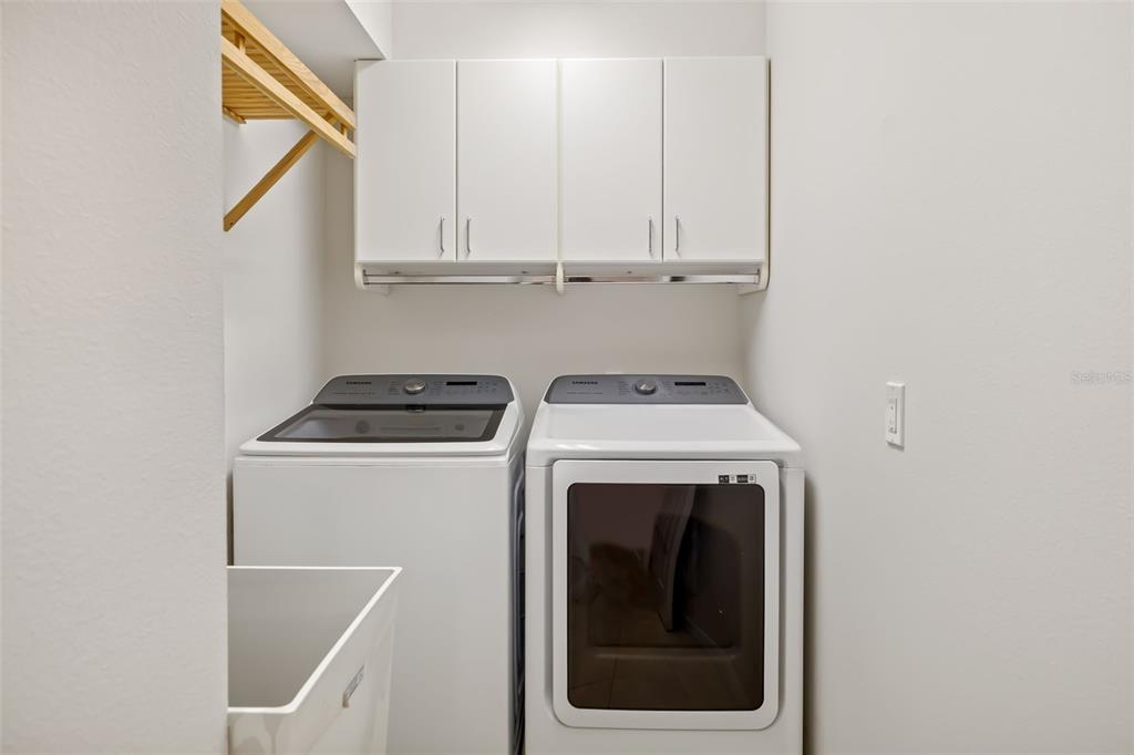 7631 Desert Inn Way Lakewood Ranch, FL 34202 - Photo 57 of 100 a utility room with dryer and washer