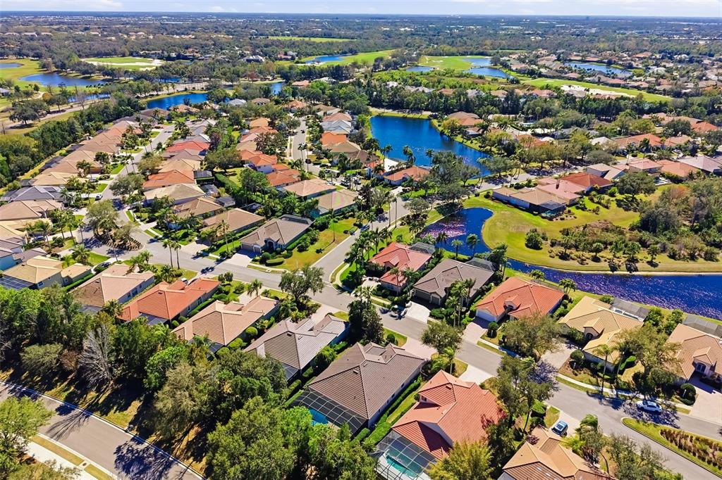 7631 Desert Inn Way Lakewood Ranch, FL 34202 - Photo 60 of 100 an aerial view of residential houses with outdoor space