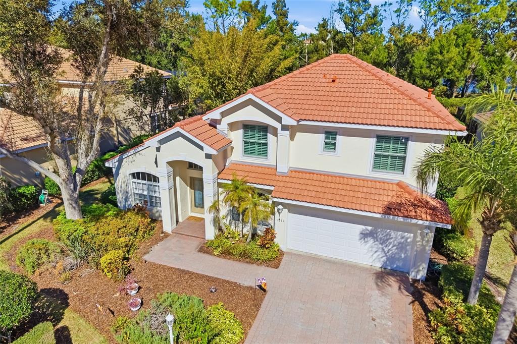 7631 Desert Inn Way Lakewood Ranch, FL 34202 - Photo 7 of 100 a front view of a house with a yard