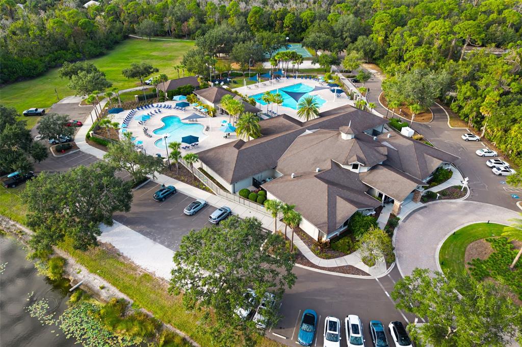7631 Desert Inn Way Lakewood Ranch, FL 34202 - Photo 83 of 100 an aerial view of a swimming pool patio and yard