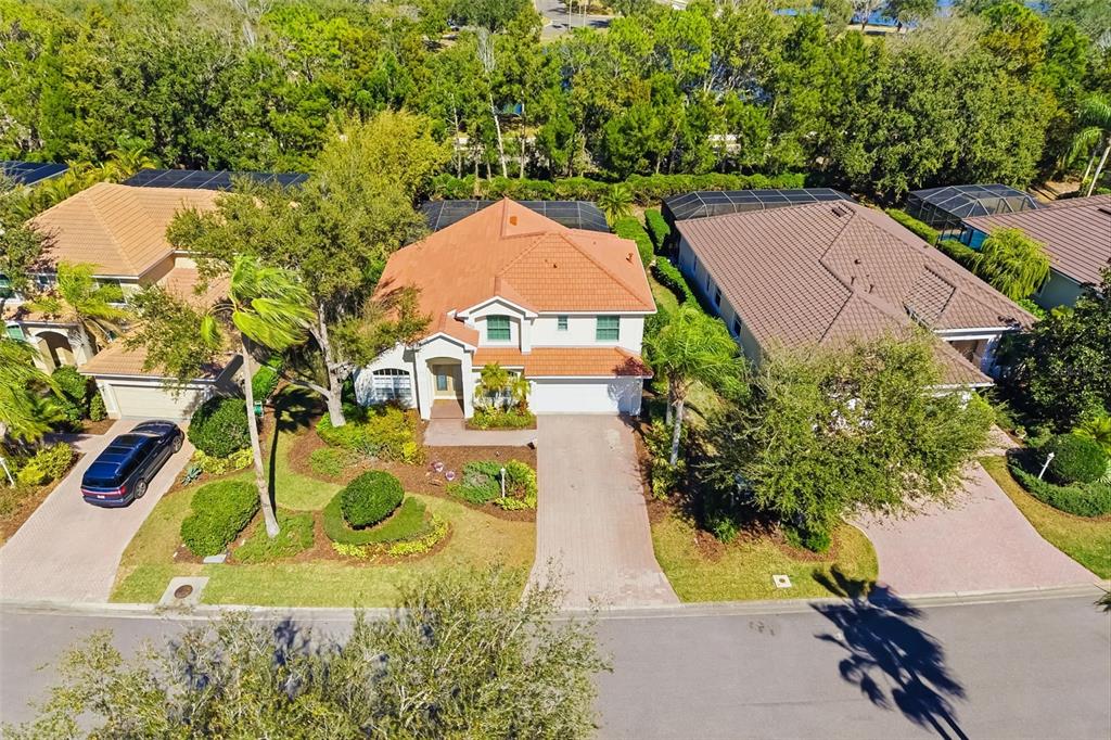 7631 Desert Inn Way Lakewood Ranch, FL 34202 - Photo 9 of 100 an aerial view of a house with a swimming pool