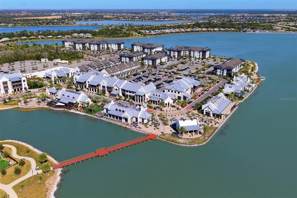 7631 Desert Inn Way Lakewood Ranch, FL 34202 - Photo 91 of 100 an aerial view of a house with a lake view