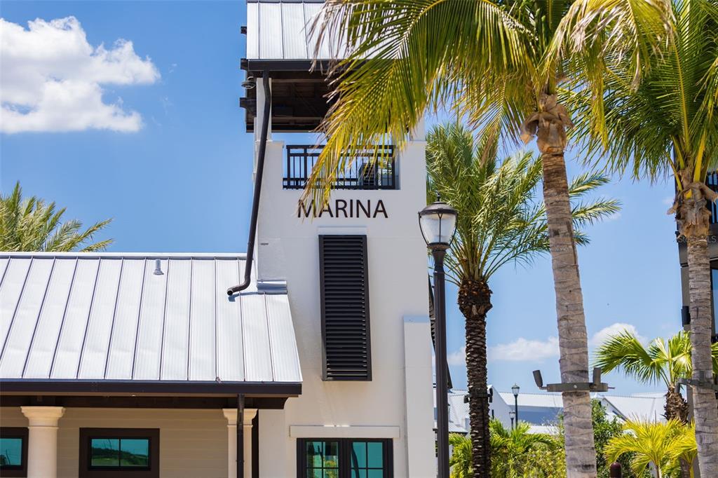 7631 Desert Inn Way Lakewood Ranch, FL 34202 - Photo 98 of 100 a sign that is on a wall next to a building