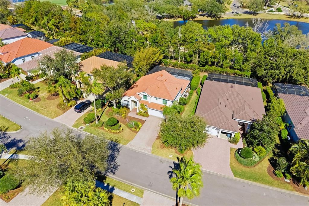 7631 Desert Inn Way Lakewood Ranch, FL 34202 - Photo 10 of 100 an aerial view of a house with a yard and garden