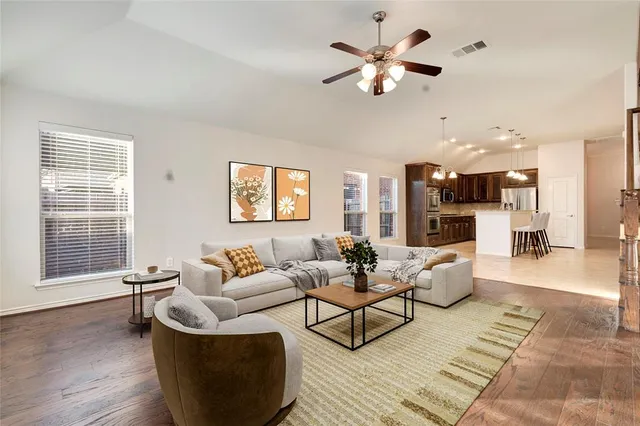 a living room with furniture and a large window
