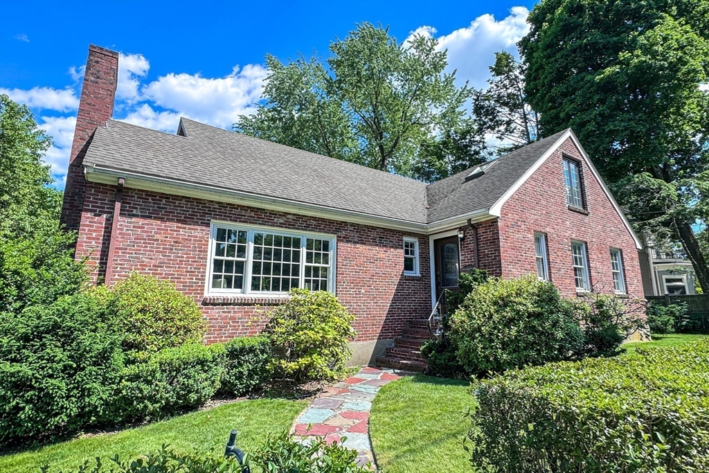 31 Sumner Road Brookline, MA 02445 - Photo 1 of 26 a front view of a house with a yard