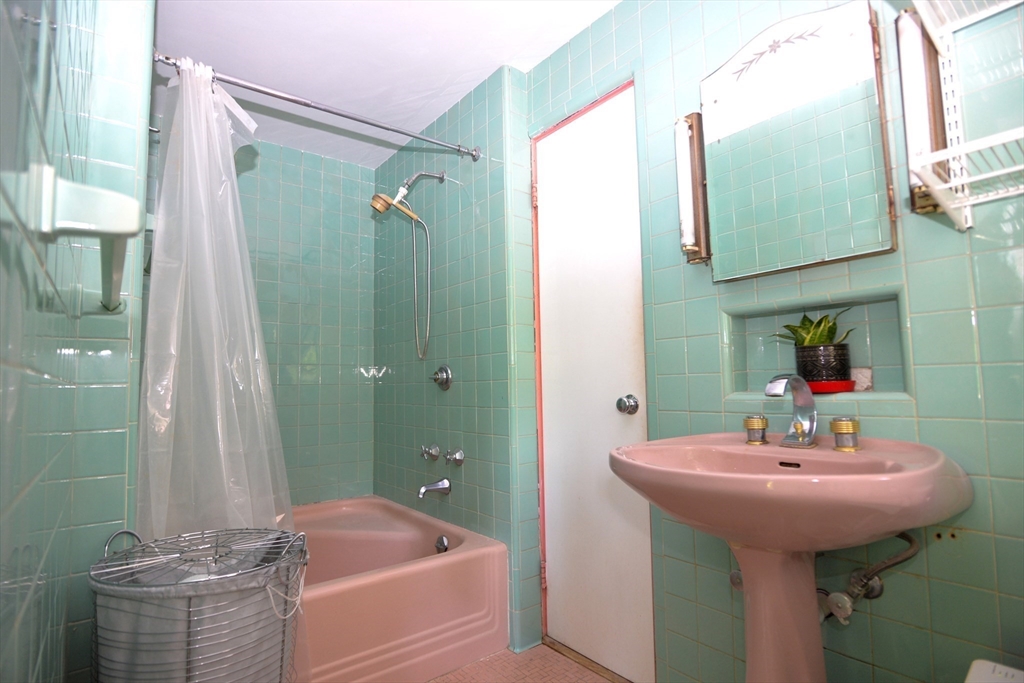 31 Sumner Road Brookline, MA 02445 - Photo 15 of 26 a bathroom with a sink and a mirror