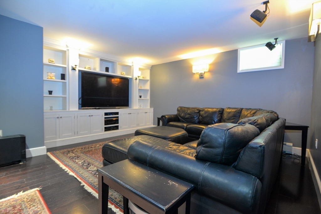 31 Sumner Road Brookline, MA 02445 - Photo 17 of 26 a living room with furniture and a flat screen tv