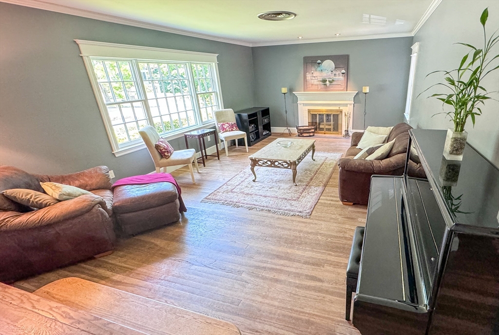 31 Sumner Road Brookline, MA 02445 - Photo 2 of 26 a living room with furniture and a large window