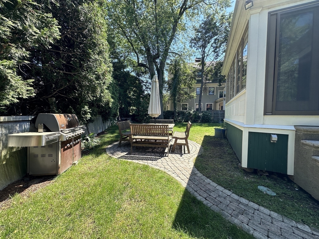 31 Sumner Road Brookline, MA 02445 - Photo 23 of 26 a view of a backyard with swimming pool