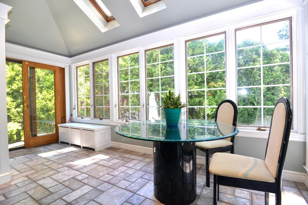 31 Sumner Road Brookline, MA 02445 - Photo 8 of 26 a view of a dining room with furniture window and outside view