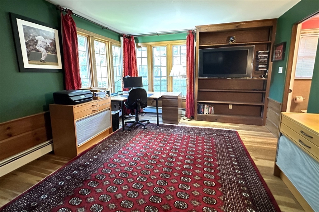 31 Sumner Road Brookline, MA 02445 - Photo 10 of 26 a living room with furniture flat screen tv and windows