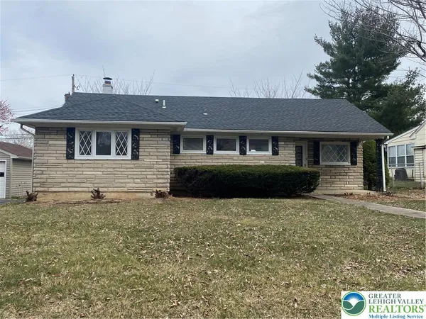 a front view of a house with yard