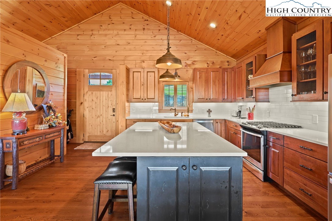 584 Grey Fox Ridge Road Banner Elk, NC 28604 - Photo 13 of 50 a kitchen with a sink appliances and cabinets