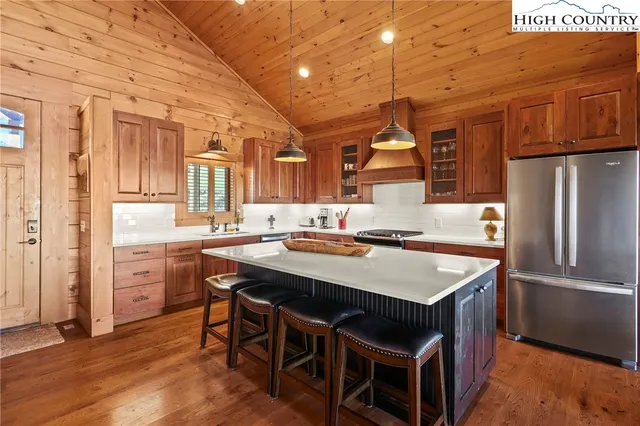 a room with furniture pool table and a rug