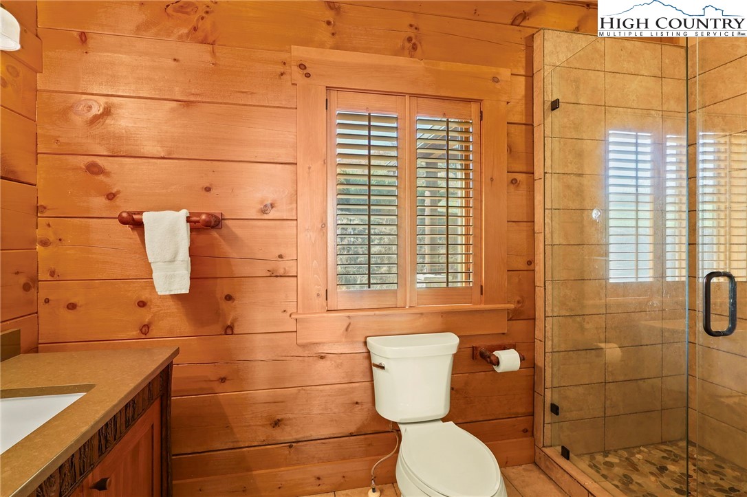 584 Grey Fox Ridge Road Banner Elk, NC 28604 - Photo 19 of 50 a bathroom with a toilet and a shower