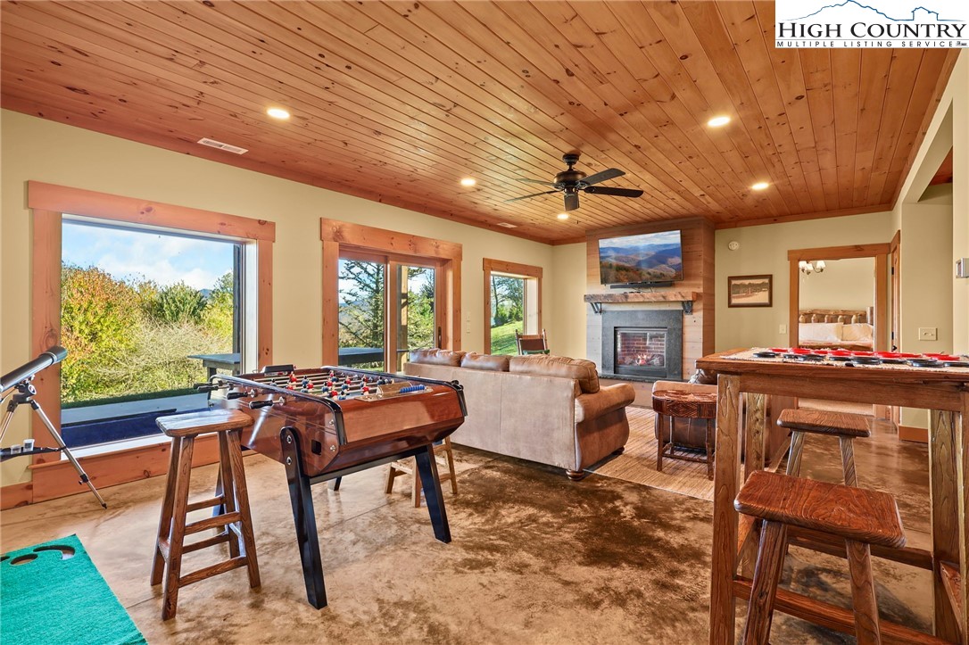 584 Grey Fox Ridge Road Banner Elk, NC 28604 - Photo 24 of 50 a room with furniture pool table and a rug