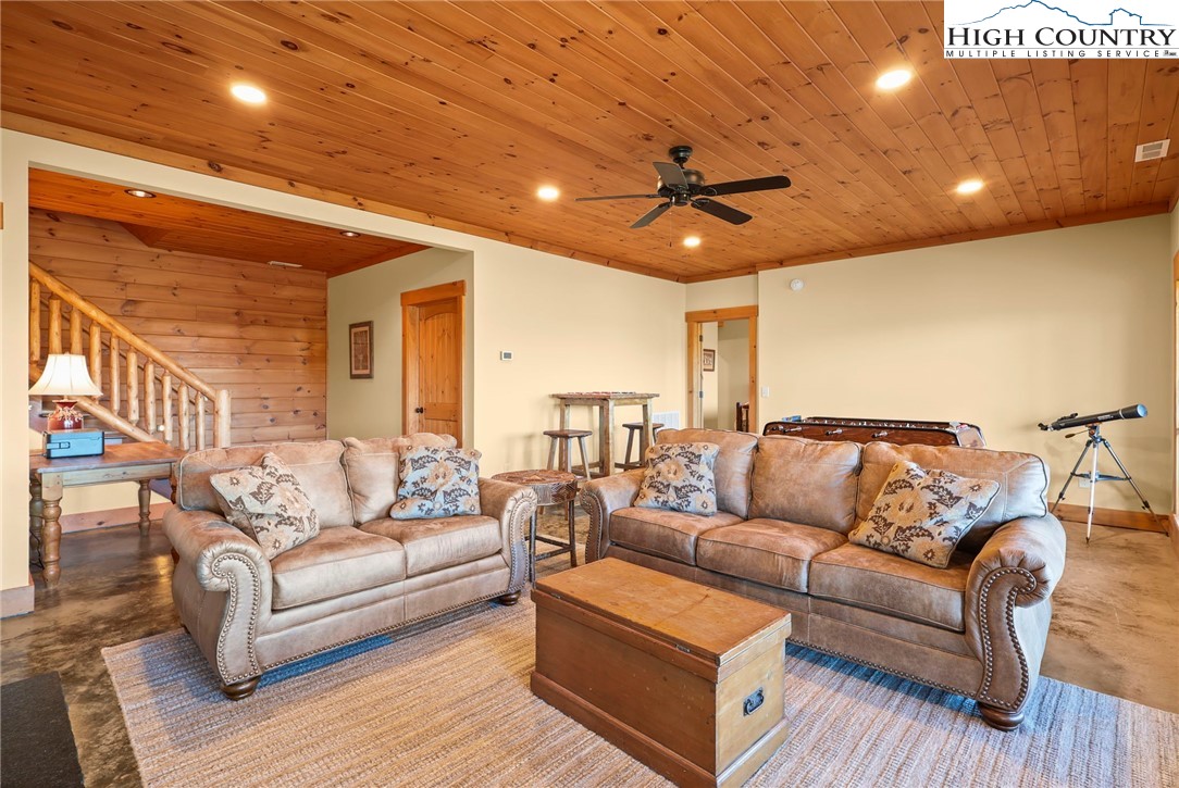 584 Grey Fox Ridge Road Banner Elk, NC 28604 - Photo 26 of 50 a living room with furniture and a ceiling fan