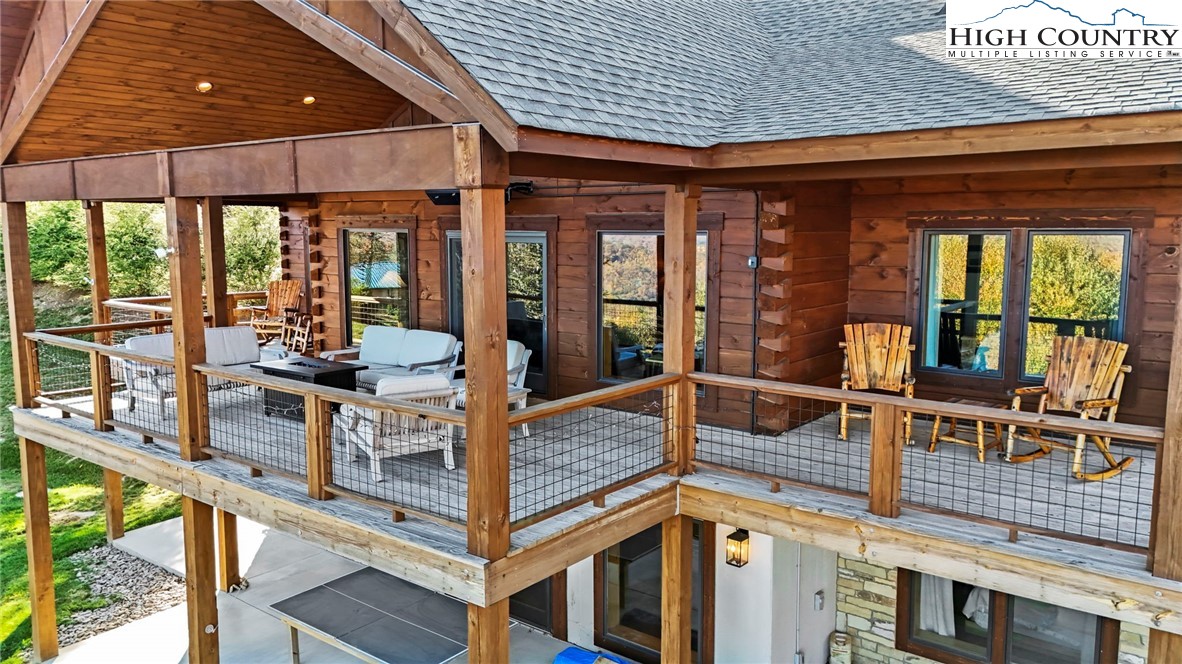 584 Grey Fox Ridge Road Banner Elk, NC 28604 - Photo 44 of 50 a view of a dining room with furniture window and outside view