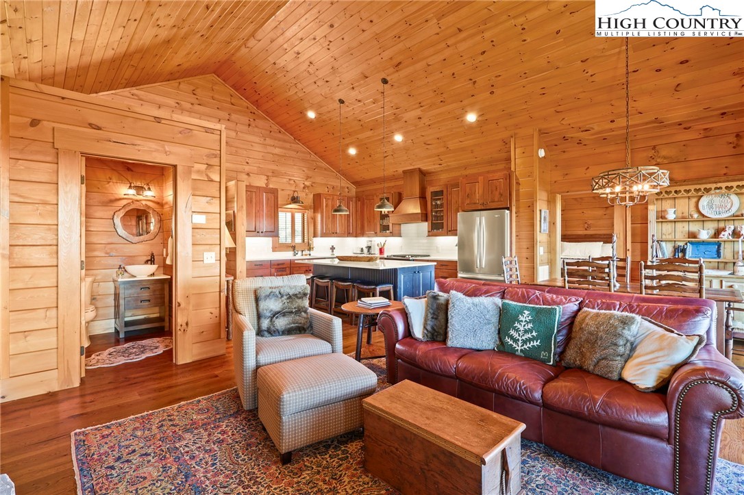 584 Grey Fox Ridge Road Banner Elk, NC 28604 - Photo 8 of 50 a living room with furniture and a view of kitchen
